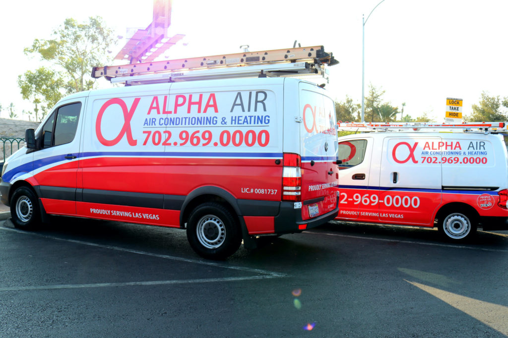 Alpha Air AC repair vans parked in a Las Vegas lot.